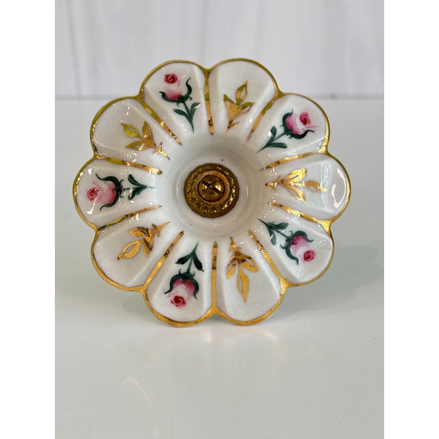 Vintage pair of hand-painted porcelain curtain tiebacks. Measuring just under 4" in diameter and decorated with pink and...