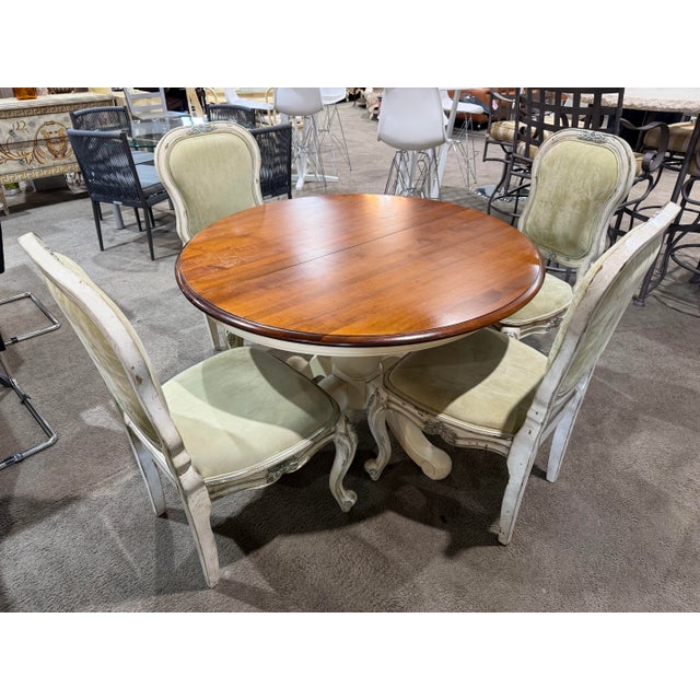 Timeless charm meets relaxed elegance in this Ethan Allen French Provincial dining set, a beautifully curated ensemble...