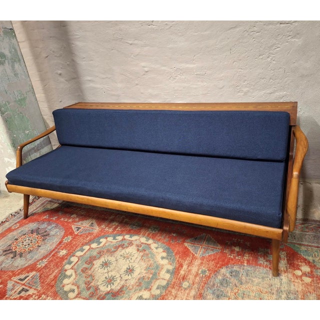 Danish teak daybed / sofa with new fabric. The back can be raised to reveal a compartment for bedding etc and to use the...