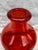 Vintage chunky, reddish orange Kosta Boda bottle. It measures 6 3/4" in diameter by 9 1/2" in height. Minor scratches on...