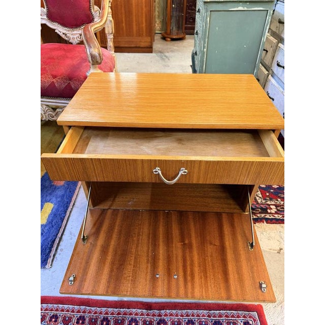 Add a touch of refined Italian design to your home with this stylish mid-century commode. Crafted from warm teak wood, the...