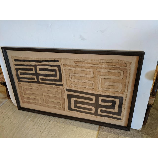Large impressive graphic geometric African Kuba cloth in handsome custom frame having neutral color palette of beige and...
