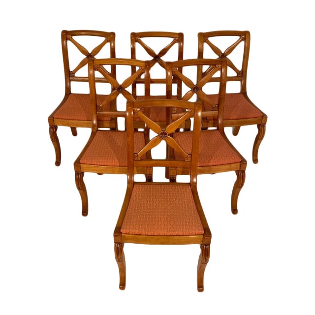 French Restoration dining chairs with additional two armchairs. All are made of hand-carved cherry wood with very strong...