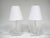 This striking matched pair of Lucite table lamps by Van Teal have style to spare. The dramatic clear lucite bases each...