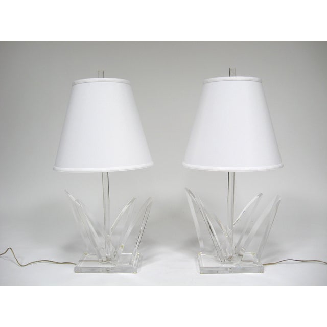 This striking matched pair of Lucite table lamps by Van Teal have style to spare. The dramatic clear lucite bases each...
