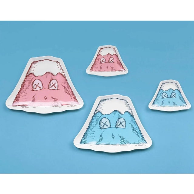 KAWS: HOLIDAY JAPAN Ceramic Plate Set (Set of 4): published to commemorate the debut of KAWS’ 40-meters-long figure placed...