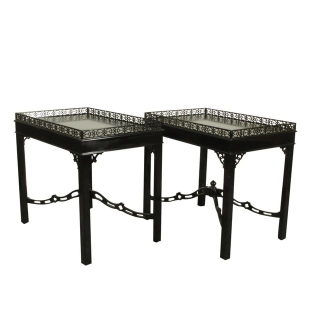 Pair of Chippendale-Style tea tables with pierced galleries and hand rubbed black lacquer finish by Kindel. Kindel is an...