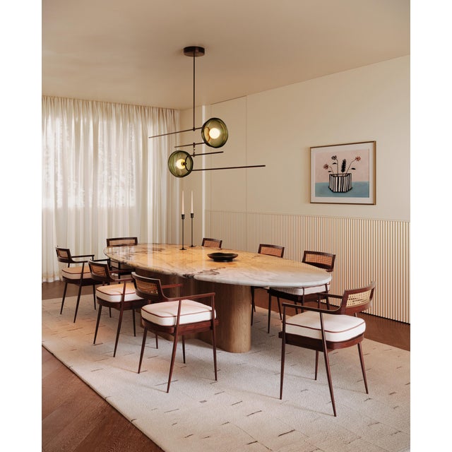 This pendant light focuses on the balance between weight and transparency. Defined by brass rod framework, the design...