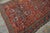 Charming Old Persian Quchan Kordi Rug With Red Background Color a Geometric Design For Sale - Image 11 of 12