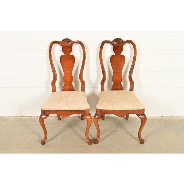 A gorgeous pair of Queen Anne or Georgian style side chairs or dining chairs By Stanley Furniture USA, Circa 1980s Solid...
