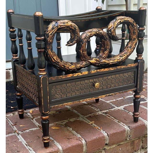 Fancy black lacquered and gilt decorated Canterbury by Bradburn. Elegant accents. This has one drawer for storage and 3...
