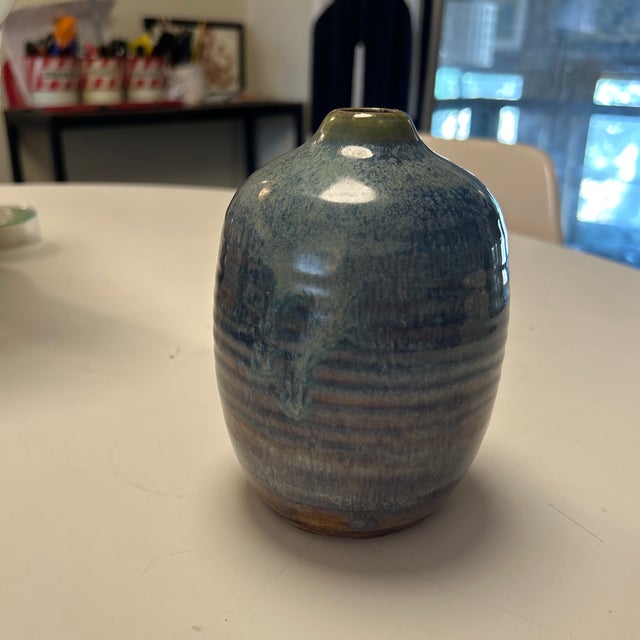 Blue and tan stoneware ceramic studio pottery vase. Numbered on the bottom. Narrow opening. No chips or cracking.