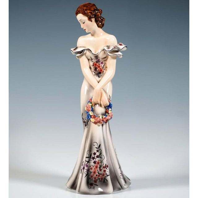 Exquisite goldscheider vienna figurine of the late 1930s: an elegant young woman in a long, form-fitting, off-the-shoulder...