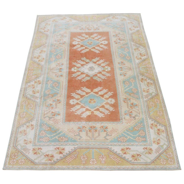 Vintage Turkish Anatolian hand knotted wool rug with natural colors.