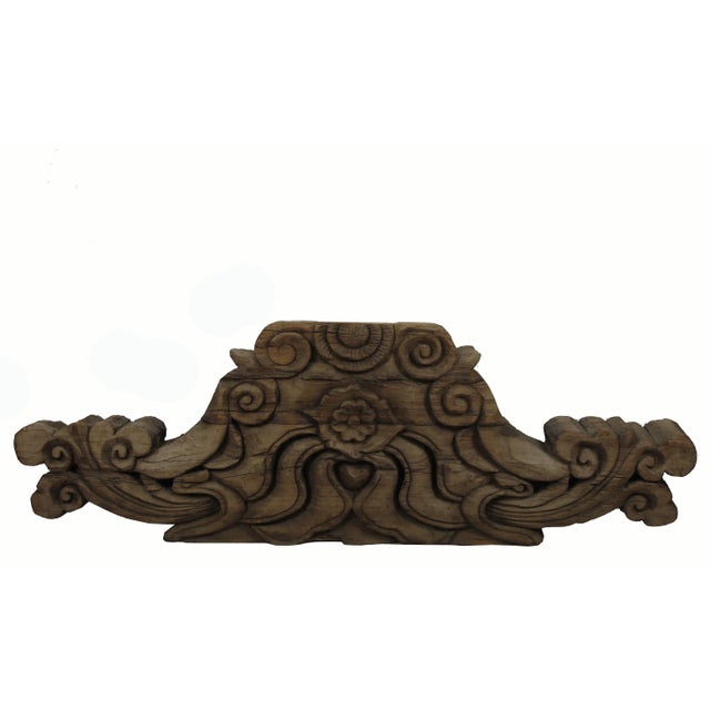 The carving on the two sides of this architectural ornament is totally different. The restoration to this piece involved...