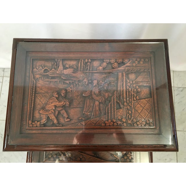 Set of 4 hand carved nesting tables attributed to George Zee. Detailed different carvings to tops and aprons.. Circa...