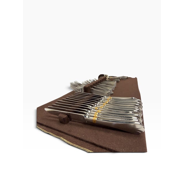 An exceptional, comprehensive 66-piece vintage flatware service for twelve in the highly collectible "Beaded Antique Gold"...