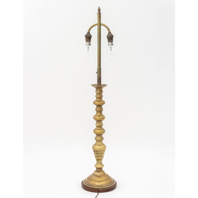 Dutch Brass Candlestick Mounted as a Table Lamp, with two light sockets and oak base. 32.75" H x 6.5" Diameter....