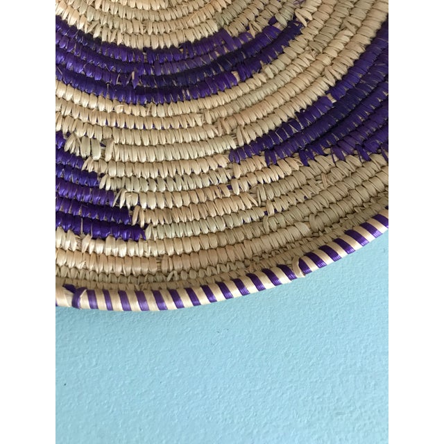 Vintage African Basket with lid in excellent condition. Handwoven with purple + tan accents.