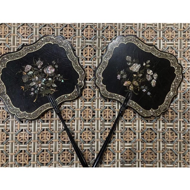 Pair of Antique Victorian Papier-Mâché Face Screens – Mother-of-Pearl Inlay, Hand-Painted Florals An elegant and finely...