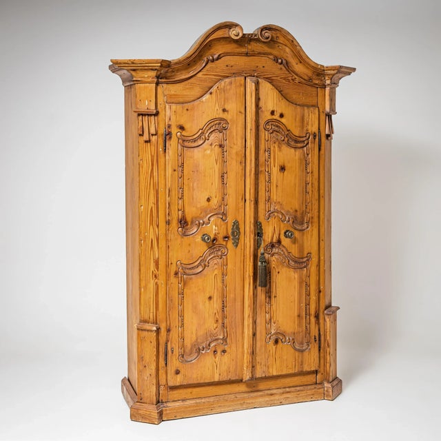 Baroque two-door wardrobe from the Irschenberg region, dating to the 18th century. Crafted from solid softwood with a...