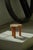 Charming Swedish folk art stool crafted from solid pine, featuring a sculptural saddle-shaped seat raised on three...