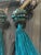 Cue pair of teal silk beaded tassels.
