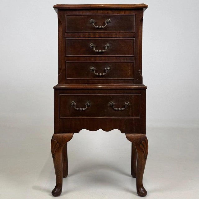 A charming and beautifully crafted early 20th-century English Edwardian chest of drawers, distinguished by its unusually...
