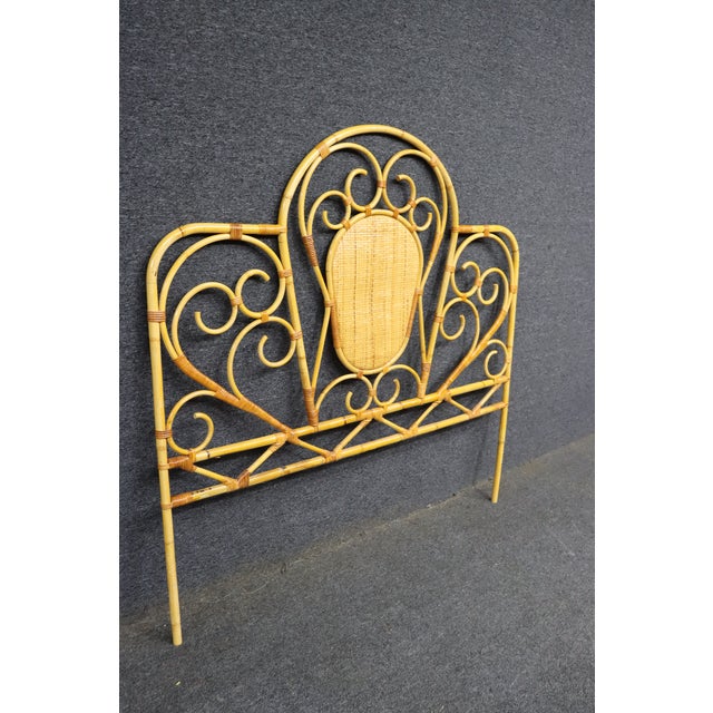 Mid century style bamboo double headboard with scrollwork detail. Arched form with woven center panel and wrapped joints....