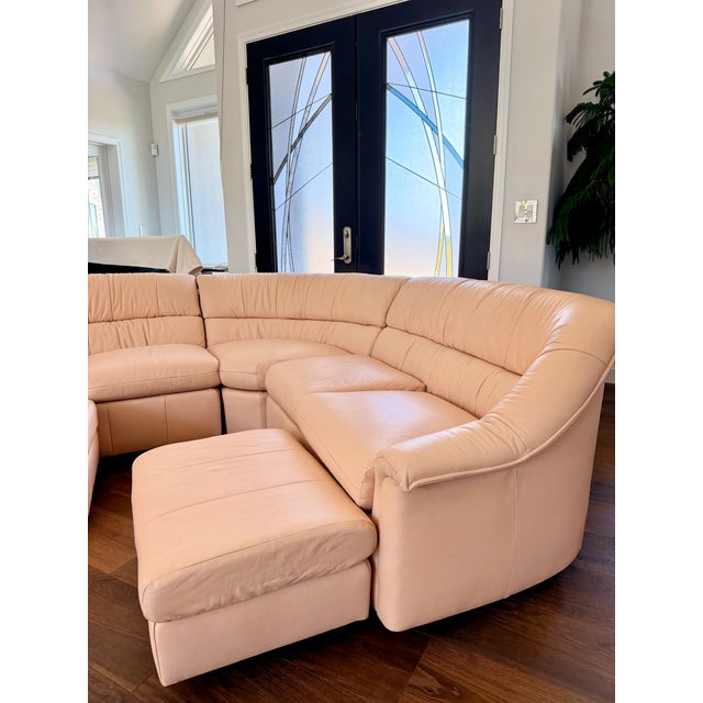 Elevate your space with this stunning vintage Leathercraft sectional, a beautifully sculpted conversation sofa designed...