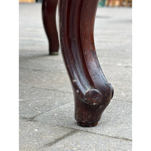 This beautifully restored cockfighting chair,a classic piece of 19th-century furniture,exudes a timeless elegance.The...