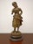 A graceful bronze statue of a young girl by the French sculptor Ernest Rancoulet depicts a finely modeled female figure in...