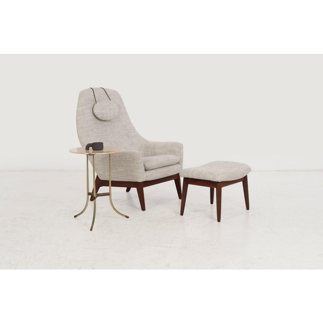 Danish Modern Lounge Chair and Ottoman, c. 1960 Elegant mid-century lounge chair and ottoman featuring solid oiled walnut...