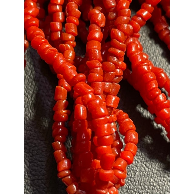 Nine strands of luscious coral red seed beads with accents of two sterling silver beads. Mediterranean red seed beads,...