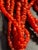 Nine strands of luscious coral red seed beads with accents of two sterling silver beads. Mediterranean red seed beads,...