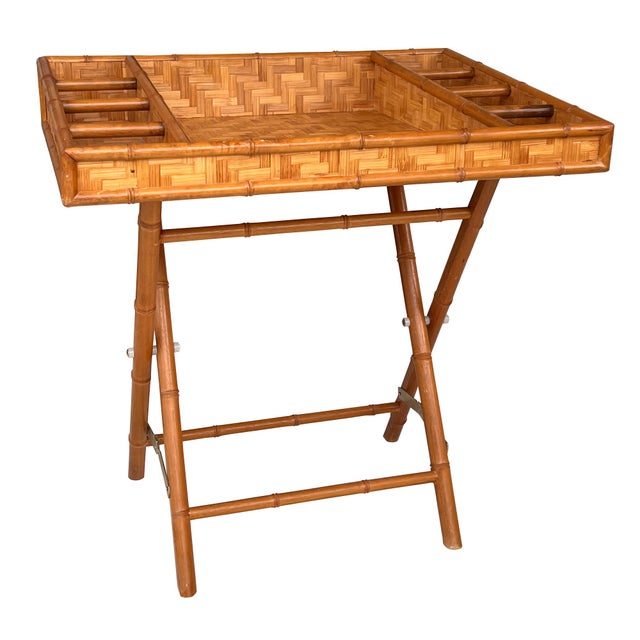 A charming vintage folding bamboo and woven rattan tray table that perfectly captures the relaxed sophistication of...