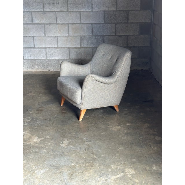 A stunning chair attributed to Lawrence Peabody for Selig. Great lines with swooping curves and barrel back- sharing some...