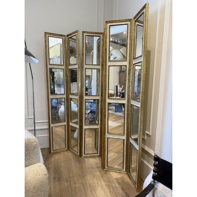 Elevate your interior with the timeless elegance of this antique giltwood folding screen featuring multiple hinged panels....