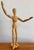 Wooden artist's posable figure on stand, features metal pins, bolts and sprung joints. The figure is attached to a stand...