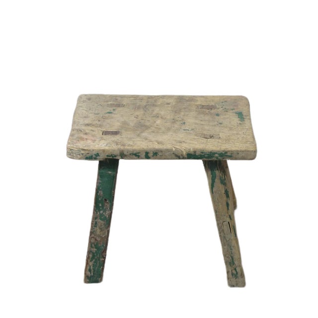 This small stool is made of solid elm and constructed mortise and tenon joinery. Solid structure. It shows age proper...