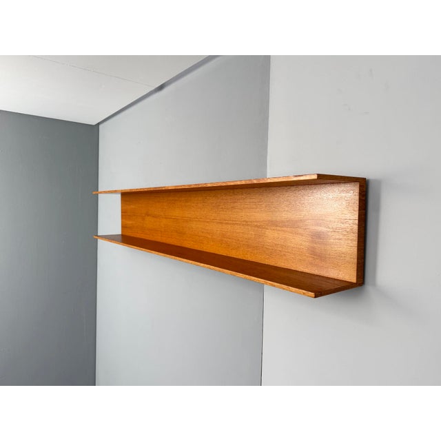 Teak Wall Shelf by Walter Wirz for Wilhelm Renz, 1960s, in Very Good conditions. Designed 1960 to 1969 This piece has an...