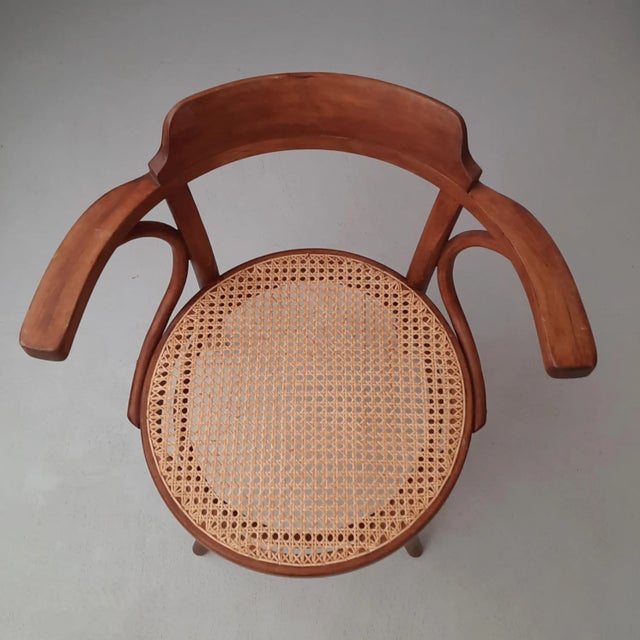 The design of chair no. 233 by Thonet dates from 1895. This chair with hand-woven rattan seat features a Thonet stamp and...