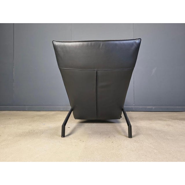 Timeless black leather chaise longue designed by Peter Mally and produced by COR. Black metal legs. Adjustable backrest....