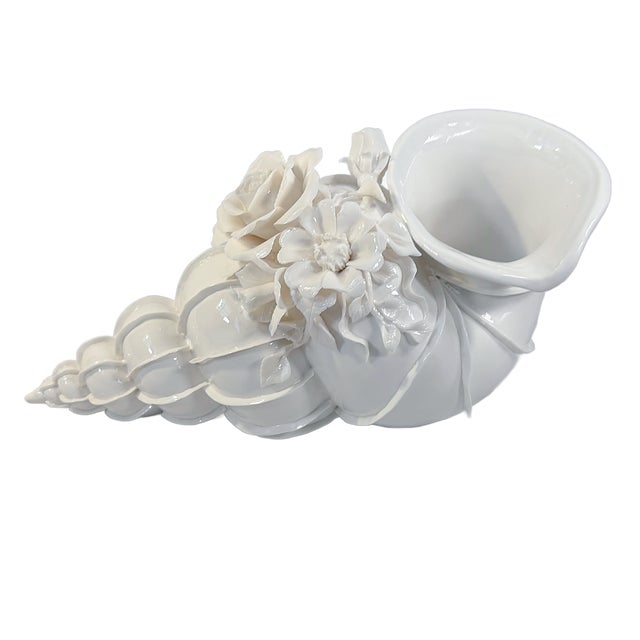 This is a large glazed white porcelain shell-form vase / planter by Castilian Imports, detailed with finely modeled...