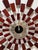 Design Plus Gallery presents a Sunburst Wall Clock from Kenneth Wingard. The clock is of mixed materials with metal rods...
