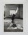 1950's snapshot photograph of young woman doing a handstand. Unframed.