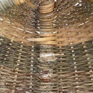 Rustic, vintage hand-woven basket with bentwood branch/vine handle in a beautiful organic shape. The basket is made from...