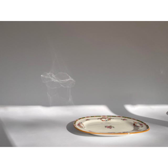 This elegant oval platter is a premier example of Edwardian luxury from the world-renowned Minton pottery, Stoke-on-Trent....