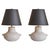 A French white ceramic table lamp from the 1960s, distinguished by its softly rounded, vessel-like form and tactile...