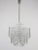 A beautiful Austrian three-tiered chandelier, executed by Kalmar Vienna in the 1960s. 16 leaf-shaped ice glass discs on a...